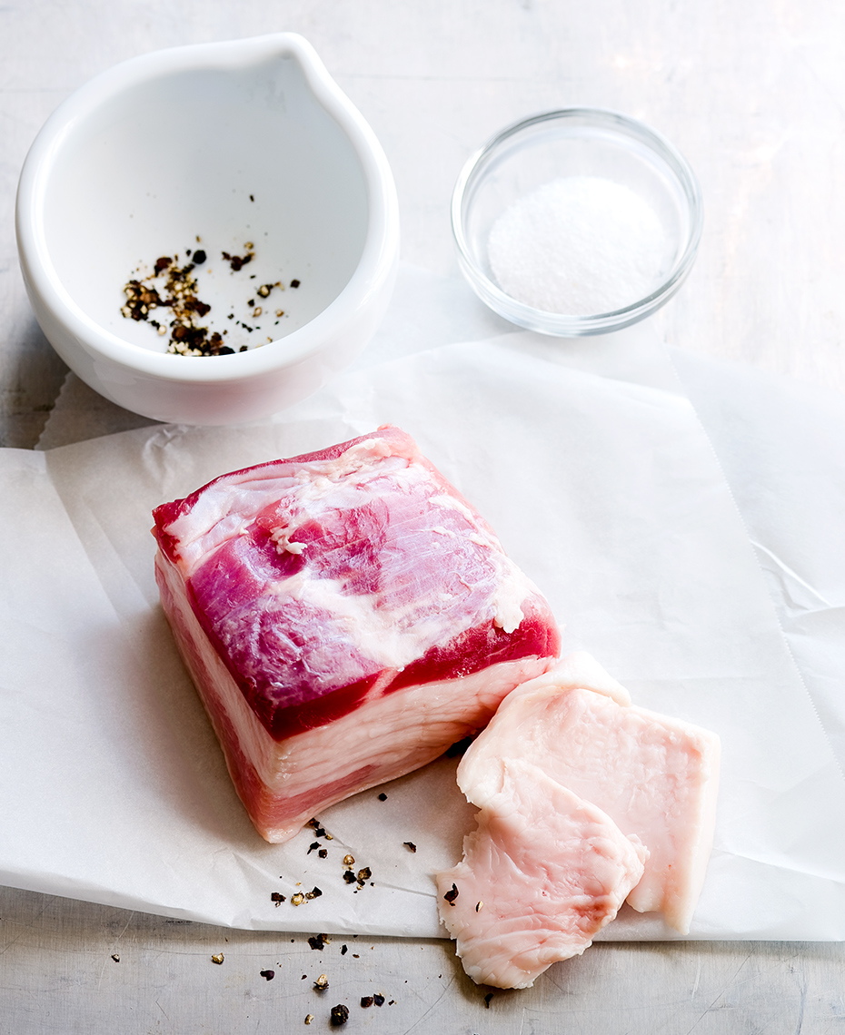 Raw meat still-life with black peppercorn