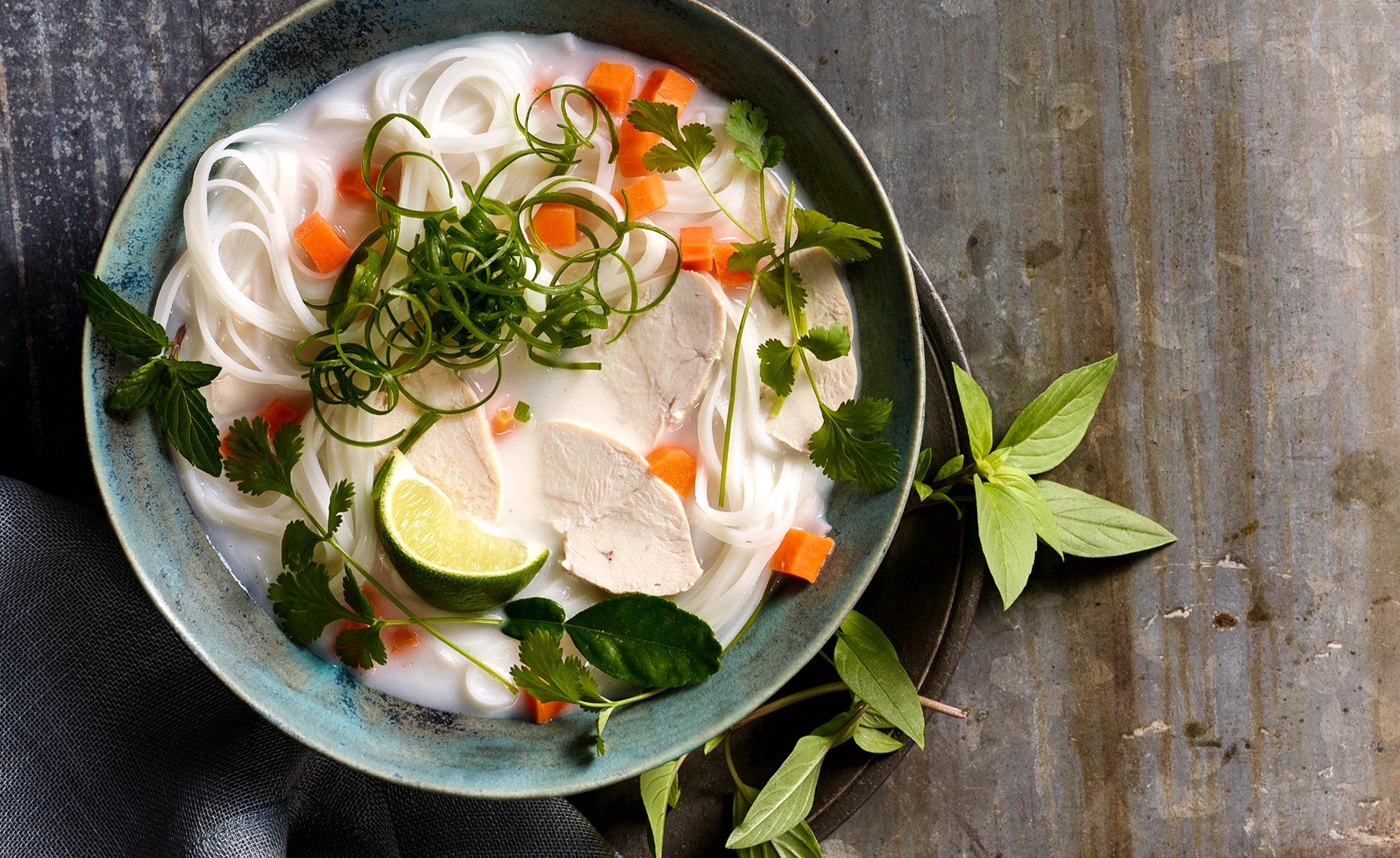 Thai chicken noodle soup with lime and fresh basil