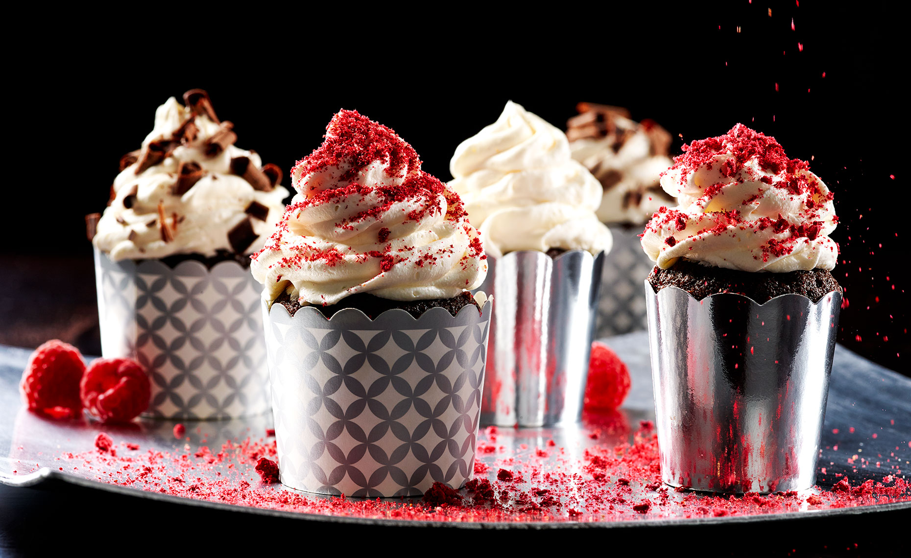Variety of chocolate cupcakes with raspberry sprinkles
