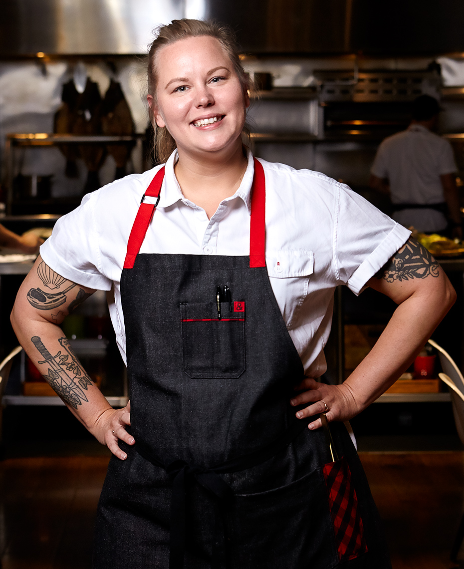 Portrait of female chef in restaurant kitchen 