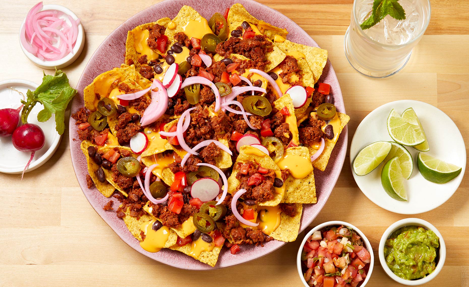 Overhead picture of nachos loaded with sausage